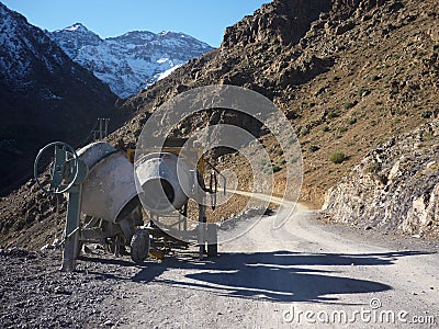 Concrete mixers on old route in Atlas mountains Stock Photo