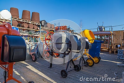 Concrete mixers on a wholesale basis. Street warehouse of a hardware store Stock Photo