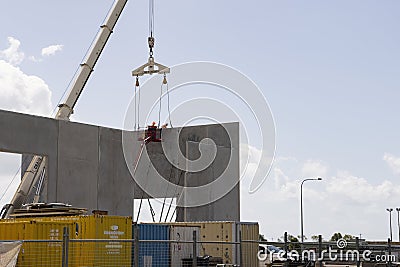 Concrete panels being lifted to build a warehouse. Editorial Stock Photo