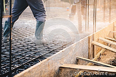 Concrete pouring during commercial concreting floors of building Stock Photo