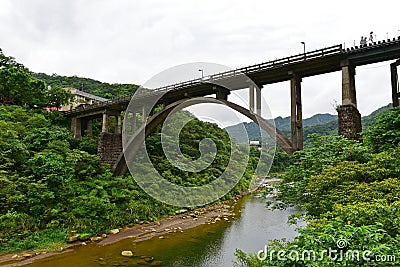 Concrete railway bridge across the river in Houtong Stock Photo