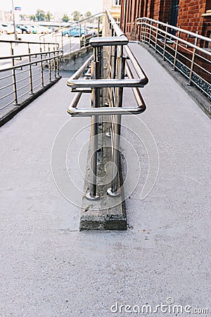 Concrete ramp way with stainless steel handrail Stock Photo