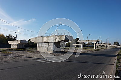 Concrete supports for the bridge, standing posters of the avenue. Stock Photo