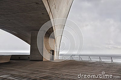 Concrete terrace with misterious industrial Atlantic Ocean view Stock Photo