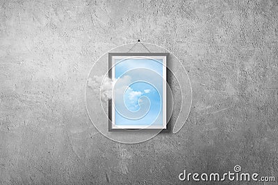 White cloud flying out from picture or photo frame that hanging on concrete wall grunge texture background. Stock Photo