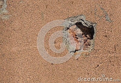 Concrete wall with a trace of a bullet shot Stock Photo