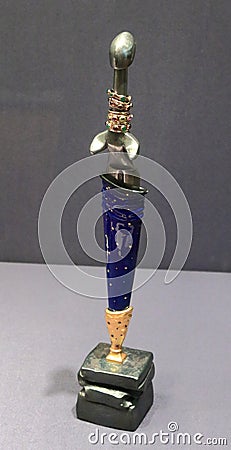 `Concubine` dagger in a blue sheath on a stand. St. Petersburg, 2008 Editorial Stock Photo