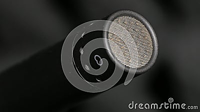 Condenser microphone in music and sound recording studio, gray background, close up. Stock Photo