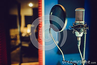 Condenser microphone in a recording studio, pop filter Stock Photo