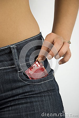 Condom in bluejeans pocket Stock Photo