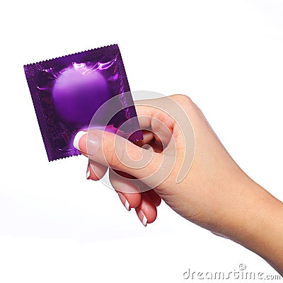 Condom in female hand isolated Stock Photo