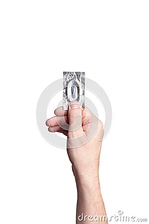 Condom in hand, on white background Stock Photo
