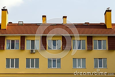 Condominium or modern apartment building with symmetrical architecture in the city downtown. Real estate development and urban gro Stock Photo