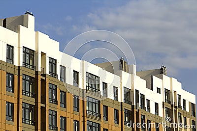 Condominium or modern apartment building with symmetrical architecture in the city downtown. Real estate development and urban gro Stock Photo