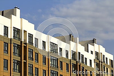 Condominium or modern apartment building with symmetrical architecture in the city downtown. Real estate development and urban Stock Photo