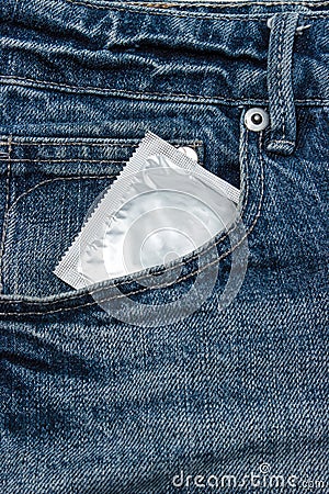 Condoms in package in jeans. Stock Photo