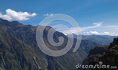 Condor flying above mountains Stock Photo