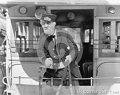 Conductor on a horse drawn streetcar holding the reins Stock Photo