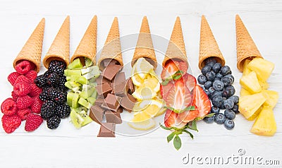 Cone waffle with fresh fruit and chocolate, homemade ice cream making Stock Photo