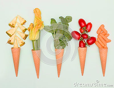 cone waffle with pineapple slices, zucchini`s flower,basil,tomatoes and baby carrot Stock Photo