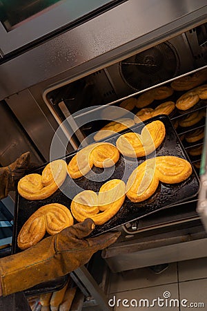 Confectioner works the puff pastry dough, artisan, gourmet, freshly baked Stock Photo