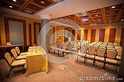 Conference hall. Many beautiful chairs and the podium are empty Stock Photo