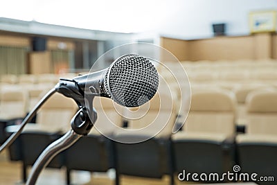 Before a conference, the microphones in front of empty chairs. Stock Photo