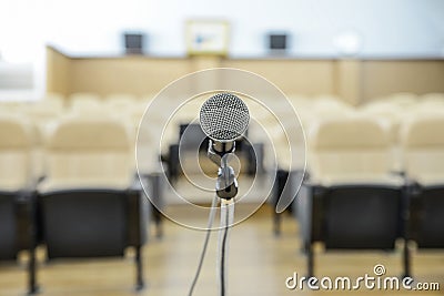 Before a conference, the microphones in front of empty chairs. Stock Photo