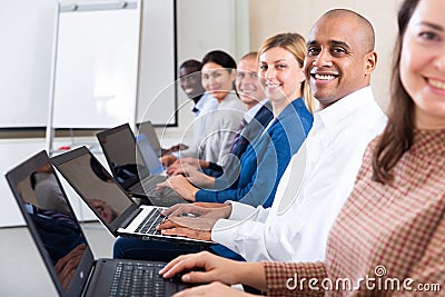 conference of positive international financial managers in white room Stock Photo