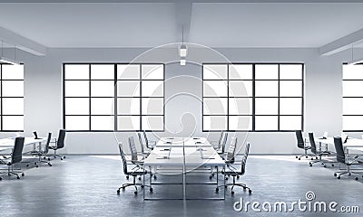 A conference room or corporate workplaces equipped by modern laptops in a modern panoramic office with white windows. Black leathe Stock Photo