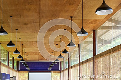 A conference room with wooden ceiling and chandelier Stock Photo