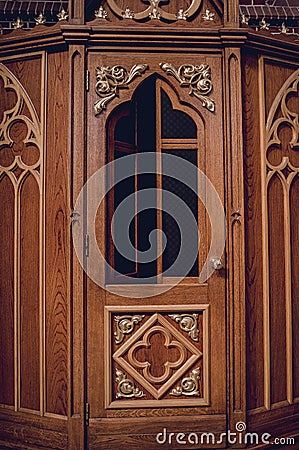 Confessional booth at the old european catholic church. Editorial Stock Photo