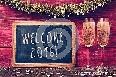 Confetti, champagne and text welcome 2016 Stock Photo