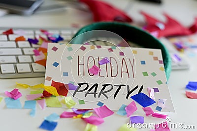 Confetti and text holiday party in an office Stock Photo