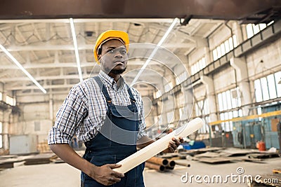 Confident African-American construction manager at workplace Stock Photo