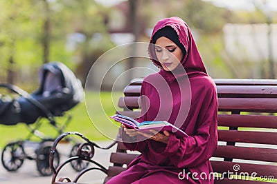Confident Arab businessman smiling and walks of Dubai. Arab Business vumen hijab is in the streets against the Stock Photo