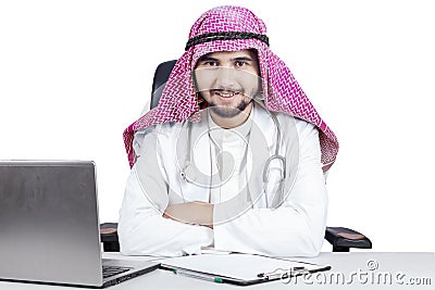 Confident Arabian doctor smiling at camera Stock Photo