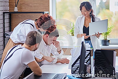 Confident asian expert training young foreign employees Stock Photo