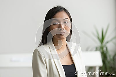Confident attractive asian businesswoman looking at camera, head Stock Photo