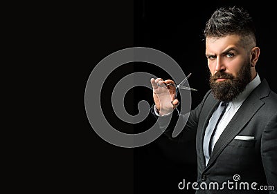 Confident barber at barbershop. Barber and hairdresser salon. Beard care, perfect beard. Bearded man in formal business Stock Photo