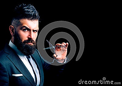 Confident barber at barbershop. Barber and hairdresser salon. Beard care, perfect beard. Bearded man in formal business Stock Photo