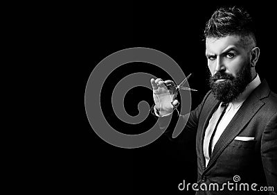 Confident barber at barbershop. Barber and hairdresser salon. Beard care, perfect beard. Bearded man in formal business Stock Photo