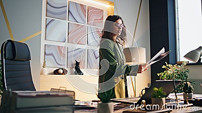 Girl manager reporting video conference in office. Businesswoman holding samples Stock Photo