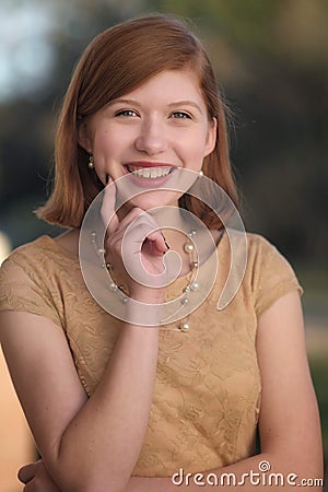 Beautiful model poses with a friendly smile Stock Photo