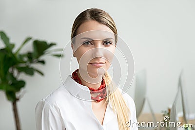 Confident beautiful young businesswoman looking at camera, head Stock Photo