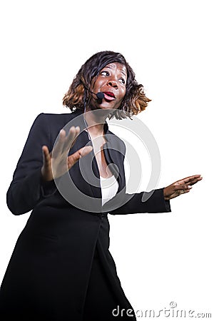 Confident black African American business woman with headset speaking at corporate seminar event in motivation coaching conference Stock Photo