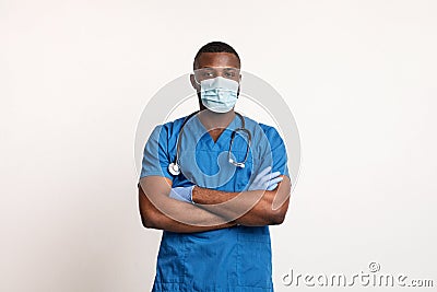 Confident black doctor in face mask and gloves over white Stock Photo