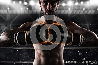 Confident boxer with fiery boxing gloves Stock Photo