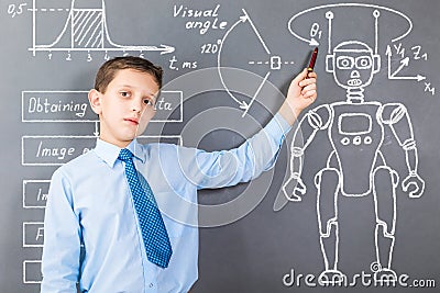 Confident boy demonstrating his knowledge in robotics Stock Photo