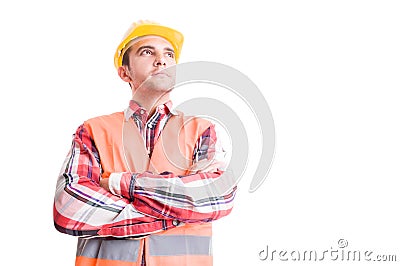 Confident builder looking up Stock Photo
